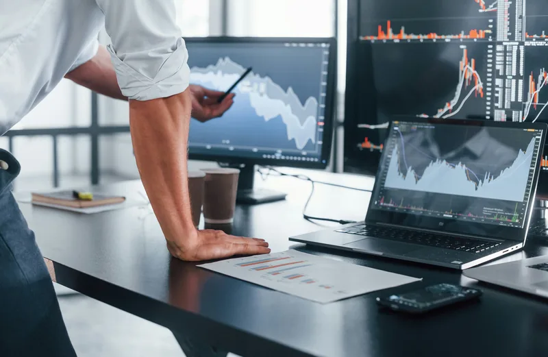 IT administrator reviewing backup reports across multiple screens